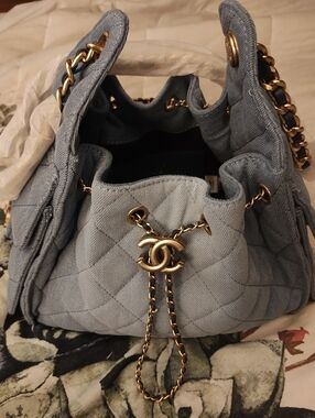 Light Blue Denim Quilted Logo Drawstring Shoulder Bag with Gold Hardware